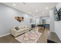 Bright living room with hardwood floors, modern decor, and an open concept layout at 2322 Arapahoe St, Denver, CO 80205