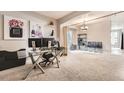 Bright, open office space features a glass desk and modern decor for a productive atmosphere at 5136 S Ceylon St, Centennial, CO 80015