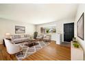 Inviting living room with hardwood floors and neutral colors, great for entertaining guests at 396 S Troy St, Aurora, CO 80012