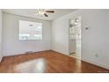 Dining area with hardwood floors and view to kitchen at 8566 Flintwood Rd, Parker, CO 80138