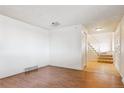 Spacious entryway with hardwood floors and staircase at 8566 Flintwood Rd, Parker, CO 80138