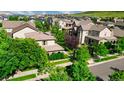 Beautiful aerial view of homes nestled among lush greenery in a well-planned, suburban community at 10328 Bluffmont Dr, Lone Tree, CO 80124