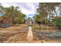 Charming home featuring a spacious front yard with a stone walkway, and a mailbox at 3074 S Elati St, Englewood, CO 80110