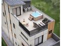 Rooftop patio with hot tub, seating, dining table, and outdoor furniture for relaxation and entertaining at 838 N Cherry St # 1, Denver, CO 80220