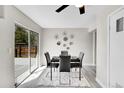 Dining area with sliding glass door and modern decor, perfect for entertaining at 807 Mobile St, Aurora, CO 80011
