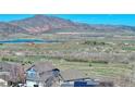 Enjoy picturesque mountain views from this home's location, featuring nearby lakes and easy highway access at 4142 S Deframe Ct, Morrison, CO 80465