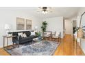 Bright living room with hardwood floors, modern furnishings, and stylish decor at 1470 S Quebec Way # 178, Denver, CO 80231