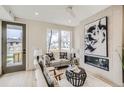 Comfortable living room featuring a modern fireplace and stylish decor at 2313 S High St, Denver, CO 80210