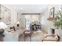Bright and airy living room with hardwood floors, a cozy fireplace, and an open layout at 764 S Corona St, Denver, CO 80209