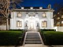 Stunning nighttime view of a grand home with manicured lawn at 727 N Washington St, Denver, CO 80203