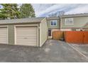Exterior view of the condo detached garage near a partially fenced patio area in an outdoor setting at 3415 S Ammons St # 24-2, Lakewood, CO 80227
