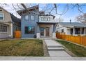 Contemporary home with a minimalist front yard and inviting entrance at 3925 Winona Ct, Denver, CO 80212