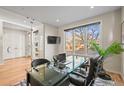 Bright home office with a glass desk, natural light, and a modern aesthetic at 3925 Winona Ct, Denver, CO 80212