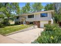 Inviting home with mature trees, a concrete driveway, and a clean, well-kept yard at 1270 Berea Dr, Boulder, CO 80305