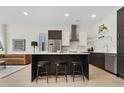 Modern kitchen with sleek cabinets, stainless steel appliances, and a large island with seating at 2530 Lawrence St # Ra101, Denver, CO 80205