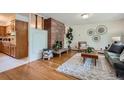 Cozy living room featuring hardwood floors, fireplace, and stylish decor at 1715 Alkire St, Golden, CO 80401