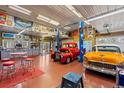 Spacious garage with car lifts, ample storage, and room for multiple vehicles or projects at 6480 W 60Th Ave, Arvada, CO 80003
