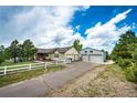 A well maintained ranch home with a detached garage on a large lot with mature trees at 5685 Columbine Ridge Rd, Elizabeth, CO 80107