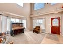 Inviting living room with tall ceilings and windows providing plenty of natural light at 20341 E 48Th Pl, Denver, CO 80249