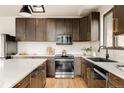 Spacious kitchen features a modern design, stainless steel appliances and ample counter space at 7290 Timber Trail Rd, Evergreen, CO 80439
