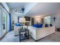 Comfortable living room with plush seating, fireplace, built-in shelves, and elegant decor creating a welcoming space at 7176 S Pierson St, Littleton, CO 80127