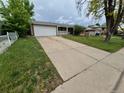 Charming single-Gathering home with a spacious driveway and attached garage at 12058 E Virginia Pl, Aurora, CO 80012