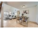 The dining room is adjacent to the living room, has wood floors and is perfect for gatherings at 324 Wright St # 304, Lakewood, CO 80228