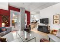 Open living area with modern furniture and balcony access at 1620 Little Raven St # 109, Denver, CO 80202