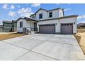 Attractive two-story home with a three-car garage and a large concrete driveway at 13920 Hanging Lake St, Parker, CO 80138