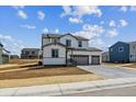 Beautiful home with a three-car garage, spacious driveway, and professional landscaping at 13920 Hanging Lake St, Parker, CO 80138