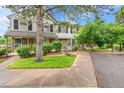 Charming townhouse featuring a well-maintained lawn and mature trees for added curb appeal and privacy at 9930 W Progress Pl, Littleton, CO 80123