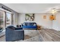 Cozy living room featuring stylish decor, ample natural light, and comfortable seating, creating a warm and inviting atmosphere at 1301 S Yampa Ct, Aurora, CO 80017