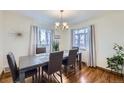 Bright dining room with hardwood floors and a large table at 4840 Depew St, Denver, CO 80212