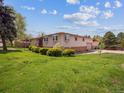 Well-maintained single-Gathering home with expansive lawn and mature landscaping at 3229 Swadley St, Wheat Ridge, CO 80033