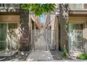 Metal entry gate showcasing contemporary design, offering privacy and security, and surrounded by landscaping at 1333 Elati St # 3, Denver, CO 80204