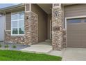 Welcoming front entrance with stone pillars and house number at 3166 Newfound Lake Rd, Berthoud, CO 80513
