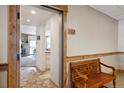 Inviting condo hallway with wood accents and bench seating near unit 102 at 720 Columbine Rd # B, Breckenridge, CO 80424