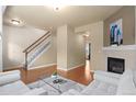 Comfortable living room with hardwood floors, fireplace, and neutral decor for a cozy feel at 1212 S Emery St # C35, Longmont, CO 80501