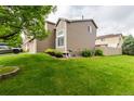 Spacious backyard with lush green lawn and garden beds, perfect for outdoor enjoyment at 3101 Goldeneye Pl, Superior, CO 80027