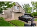 Two-story home with attached garage, complemented by a neat lawn and easy landscaping at 3101 Goldeneye Pl, Superior, CO 80027
