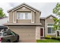 Two-story home boasts well-kept lawn, neutral siding, and attached two-car garage with driveway at 3101 Goldeneye Pl, Superior, CO 80027