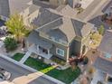 Aerial view of the home, showcasing the roof, landscaping, and surrounding neighborhood at 311 S Parkside Dr, Longmont, CO 80501