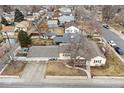 Aerial view of the property showcasing the home, yard, and neighborhood at 8001 W 57Th Ave, Arvada, CO 80002