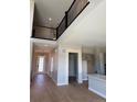 Open concept living area with dark iron railing and lots of natural light at 898 Coal Bank Trl, Castle Rock, CO 80104
