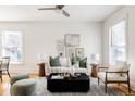 Bright living room with white sofa, stylish coffee table, and decorative art creating a cozy atmosphere at 1000 N Ogden St, Denver, CO 80218