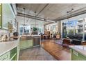 Open living space featuring a modern kitchen with stainless steel appliances and great natural light at 290 W 12Th Ave # 303, Denver, CO 80204