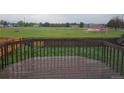 View of a large sports field from the backyard deck of the home at 880 Orion Dr, Lafayette, CO 80026