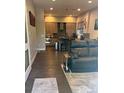 Modern kitchen featuring stainless steel appliances and a central island at 2898 W 22Nd Ave, Denver, CO 80211
