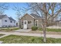 Charming home with gray siding, a white door, and neatly trimmed landscaping adding to its curb appeal at 4344 Chase St, Denver, CO 80212