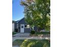 Charming home with gray siding, a white door, and neatly trimmed landscaping adding to its curb appeal at 4344 Chase St, Denver, CO 80212
